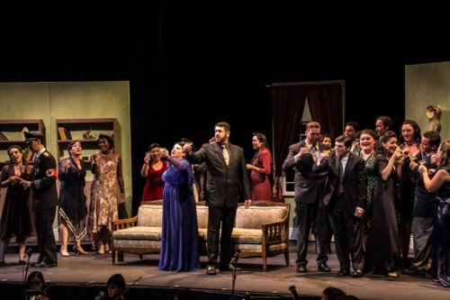 A performance of Die Fledermaus. Chorus and principles toasting